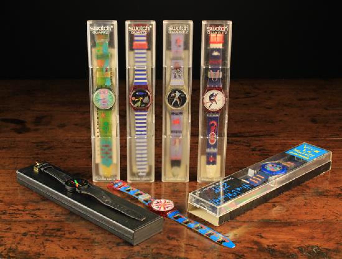 Seven Watches: Four Swiss-made Swatch Quartz Beach: Seven Watches: Four Swiss-made Swatch Quartz Beach Watches, A Zot watch 'Viva La Wombat', and an Anker Quartz Watch, all with original boxes, and an unboxed 'Chicken' Swatch watch.