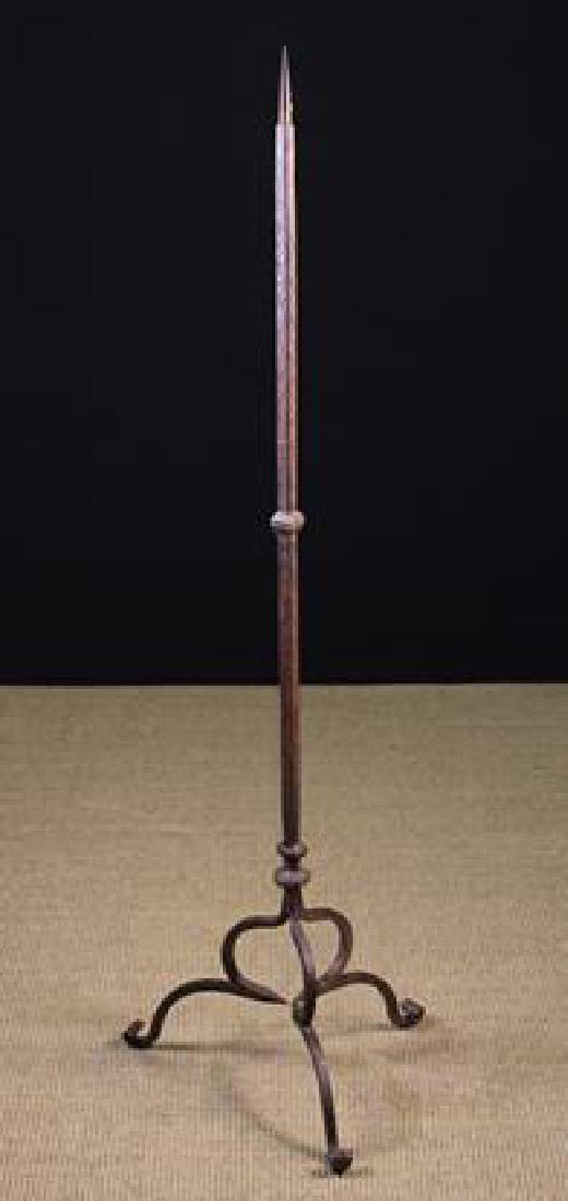 A Wrought Iron Gothic Revival Floor Standing Pricket: A Wrought Iron Gothic Revival Floor Standing Pricket Candlestand attributed to Samuel Yellin (1884-1940). The pricket atop a square section stem with incised ornamentation and a mid-height knop, leadi