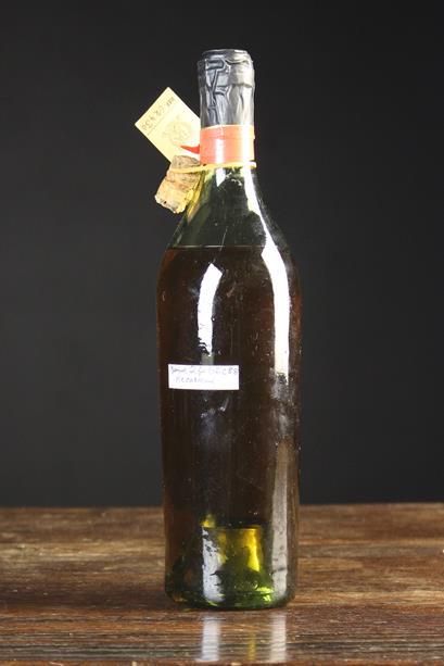 An Old Bottle of Whisky with a Christie's label ,: An Old Bottle of Whisky with a Christie's label , opened 26 Dec 88 and re-corked, with original cork attached.