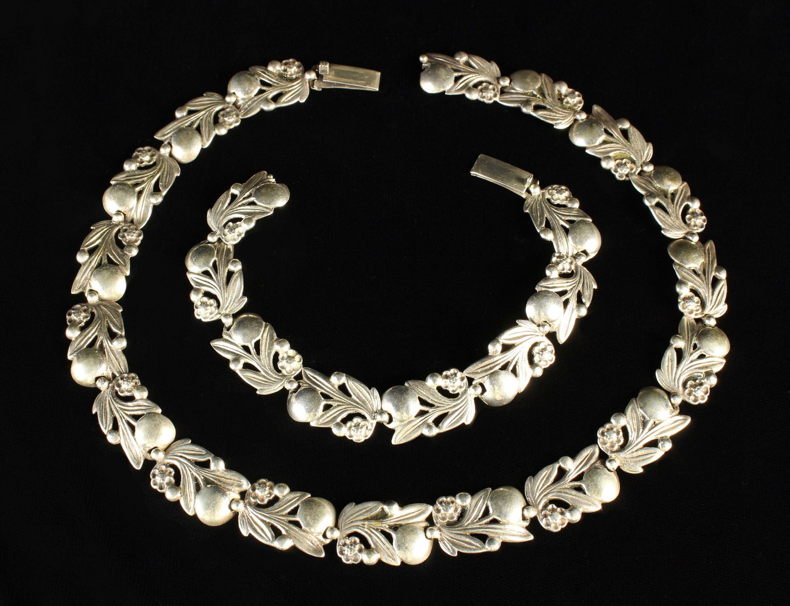 A Vintage Silver Bern Necklace & Matching Bracelet both: A Vintage Silver Bernard Instone Necklace & Matching Bracelet both stamped Silver, made in England with makers' mark B.I. The necklace 16½'' (42 cm) in length, the bracelet 7½'' (19 cm).