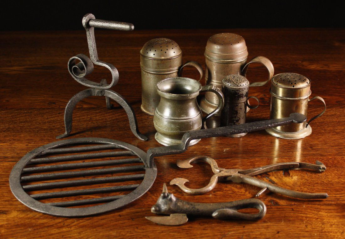 A Collection of Metalware: A pewter Yates & Birch: A Collection of Metalware: A pewter Yates & Birch half pint tankard 3¾ ins (9.5 cms) in height. A gridiron of circular form with a stepped handle 18 ins (46 cms) in length. A 19th century goffering i