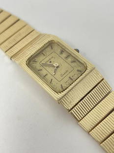 GENEVE Quartz 14k Wrist Watch: Marked 585 on the back of the watch on 585 ITALY on the clasp. 43.5 total grams. 7.75" Approximate total length. Ronda Swiss Movement. Some scuffing on the glass. Needs new battery.