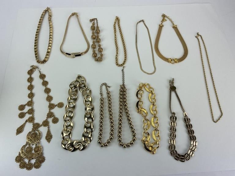 Vintage Gold Tone Jewelry Lot: Makers marks include Swarovski, MONET, LCI.