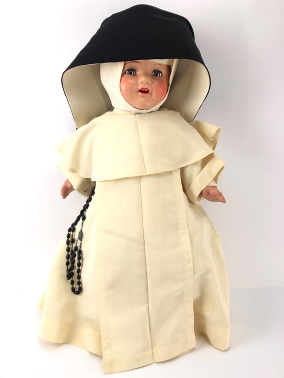 Vtg Dominican Nun Porcelain Doll Handpainted: Vintage Dominican Nun porcelain doll in full habit measuring 21 inches in height. Features handpainted face with red cheeks and blue eyes that open and close. The doll wears a cream-colored habit with
