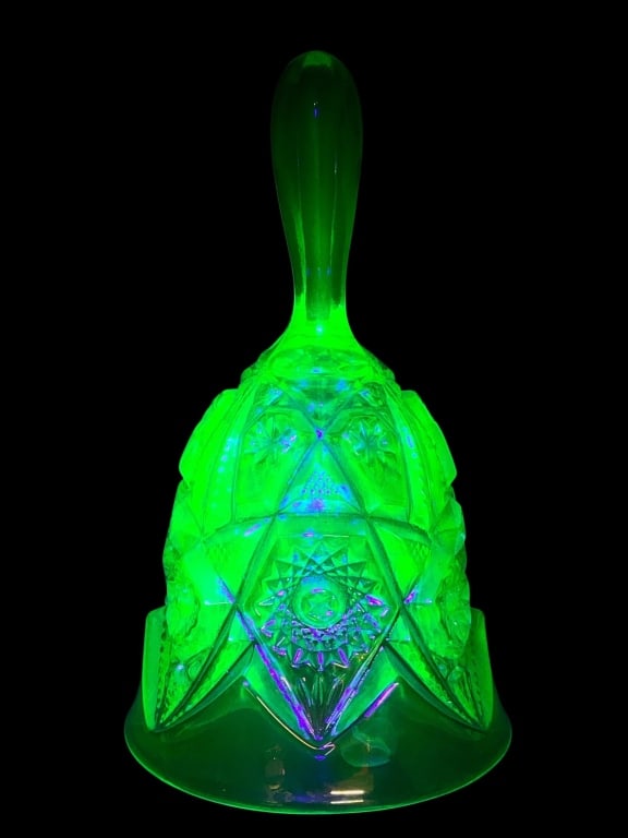 Uranium Imperial Carnival Glass Bell 6.5?? Tall: Uranium Imperial Carnival Glass Bell standing 6.5 inches tall. Features intricate carnival glass patterning with uranium content, exhibiting a green fluorescent glow under UV light. Includes functiona