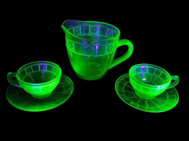 Uranium Glass Doric Pitcher And Tea Cups & Saucers