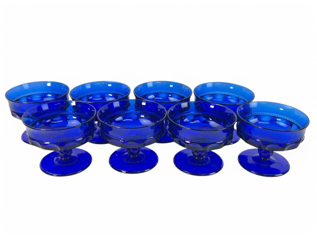 (8) Vtg Colony Color Crown Cobalt Sherbet Glasses: Set of eight Vintage Colony Color Crown cobalt blue sherbet glasses, each standing 3 1/8 inches tall. Features a vibrant cobalt blue hue and detailed design. In excellent condition.