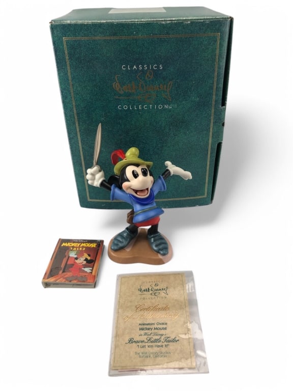 Walt Disney Brave Little Tailor Figurine: 1993 Walt Disney Collectors Society "Brave Little Tailor" figurine, approx. 7 inches tall. Includes original box, Certificate of Authenticity, and Mickey Mouse Tales companion book.