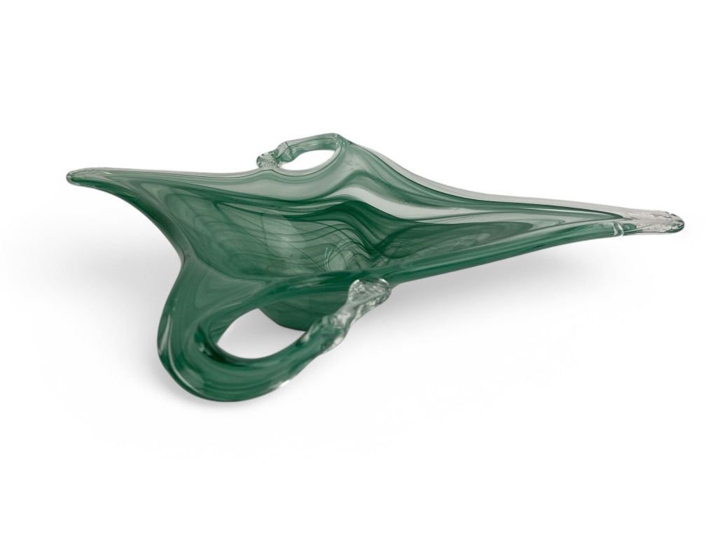 Green Hand-Blown Art Glass Bowl: Hand-blown green art glass bowl with a sculptural design. Features fluid, swirling green patterns and two handle-like extensions. Base is polished with a circular design.