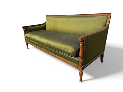 Green Upholstered Meyer Gunther Martini Sofa: Meyer Gunther Martini sofa featuring green upholstered fabric with wood frame. Dimensions: 70" W x 30" D x 33" H. Minor fabric tears, light musty smell, and scuffs/dings on wood noted. Fabric shows a