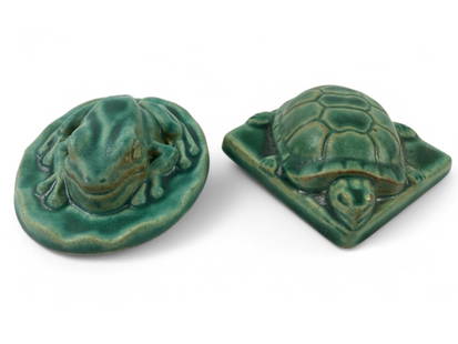 Pewabic Detroit Frog And Turtle Tiles: A pair of Pewabic Pottery tiles from Detroit, dated 2005 and 2004, featuring frog and turtle designs in green glaze. Both tiles are marked with the Pewabic stamp on the base.