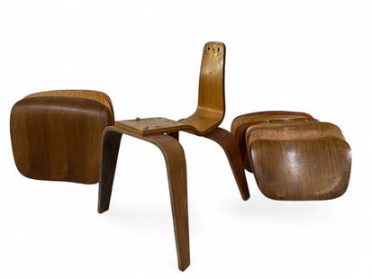 MCM Eames For Herman Miller Chair Parts Lot: MCM Eames for Herman Miller chair parts, including frame, 17 chair backs (approx. 16" x 10") and 4 chair seats (approx. 19.5" x 16") in varying wood tones and conditions. Base of chair frame stamped '