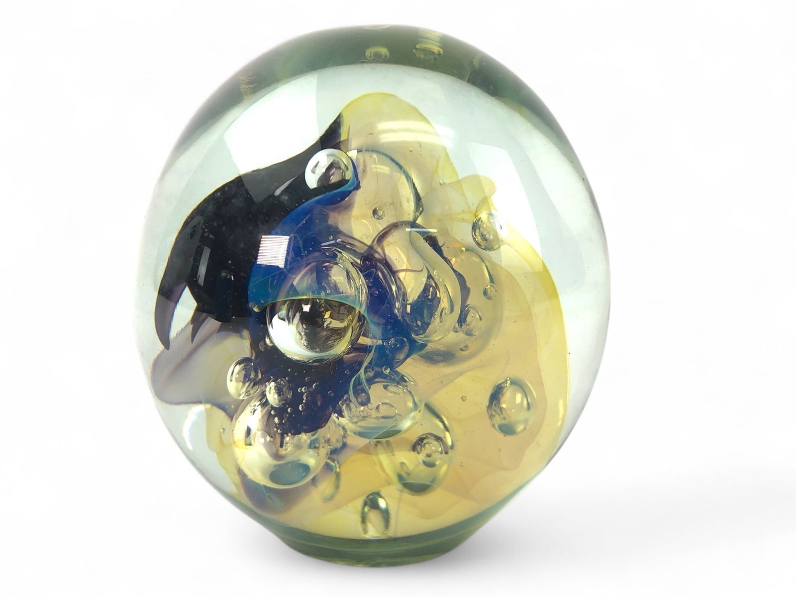 Signed Eickholt Art Glass Sculpture: Signed Eickholt art glass sculpture measuring 4 inches tall. Features a clear glass design with internal colorful patterns and bubble inclusions. Signature visible on the base.