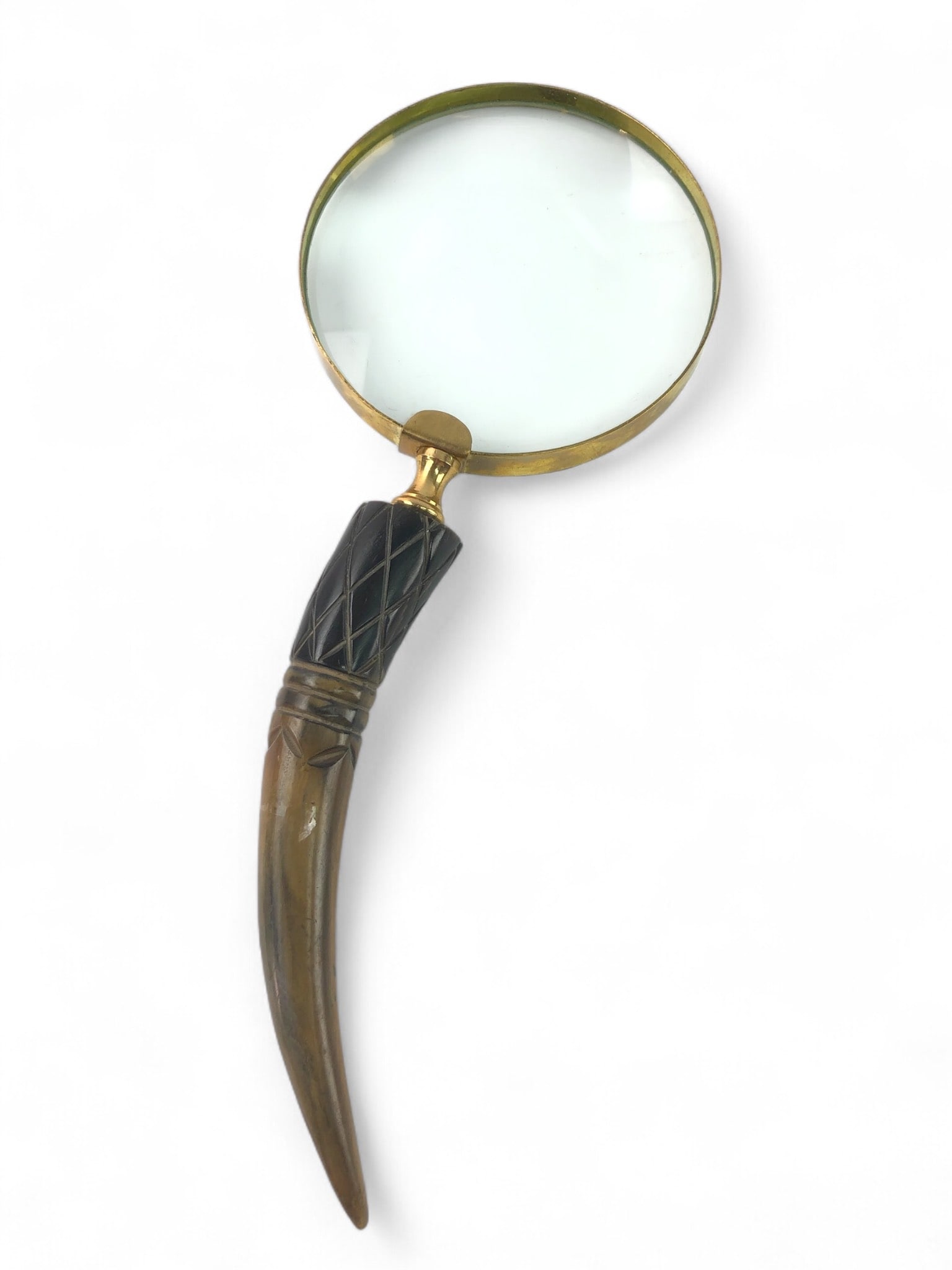 Antique Stag Antler Handle Magnifying Glass: Antique magnifying glass featuring a 10.5-inch-long design with a stag antler handle and brass rim. The handle has an intricate carved pattern, adding to its visual appeal. Glass is intact.