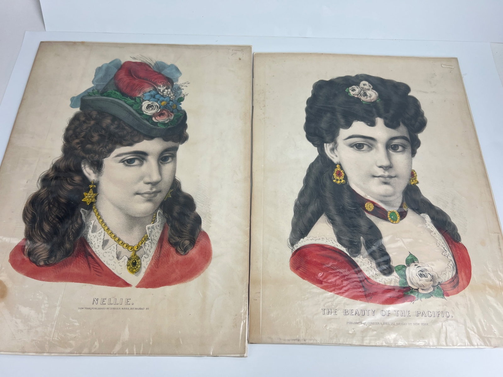 Currier & Ives Lithographs: Currier & Ives lithographs featuring â€?Nellie' (12.5 x 17 inches) and â€?The Beauty Of The Pacific' (12 x 16 inches). Both prints were published in New York and display vivid, detailed co