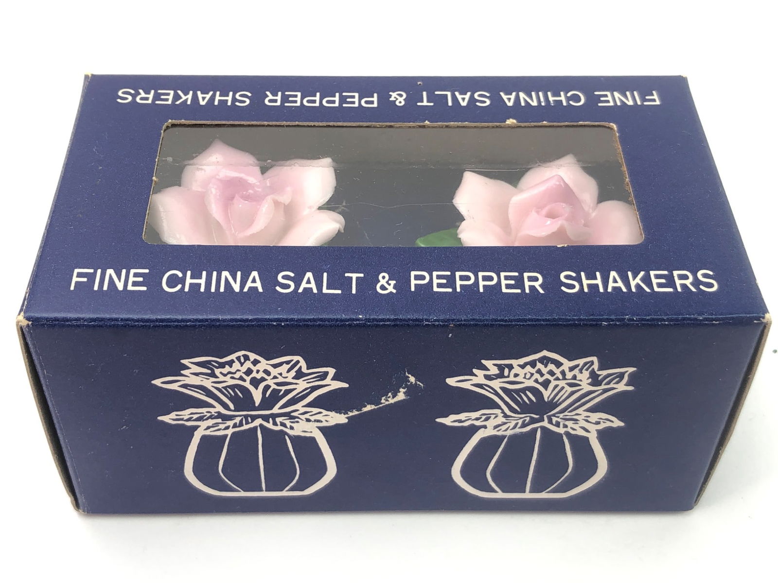 Fine Diamantine China Pink Rose Shakers: Fine Diamantine China salt and pepper shakers in the shape of pink roses with green leaves, made in Japan. Includes original packaging marked Bob Heekin"s, Pompano Beach.