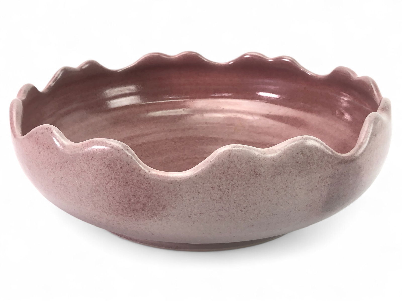 Signed Pink Ceramic Bowl With Scalloped Rim: Handcrafted 10.5-inch diameter ceramic bowl featuring a soft pink glaze and a scalloped rim. Artist-signed on the base. Suitable for display or use.