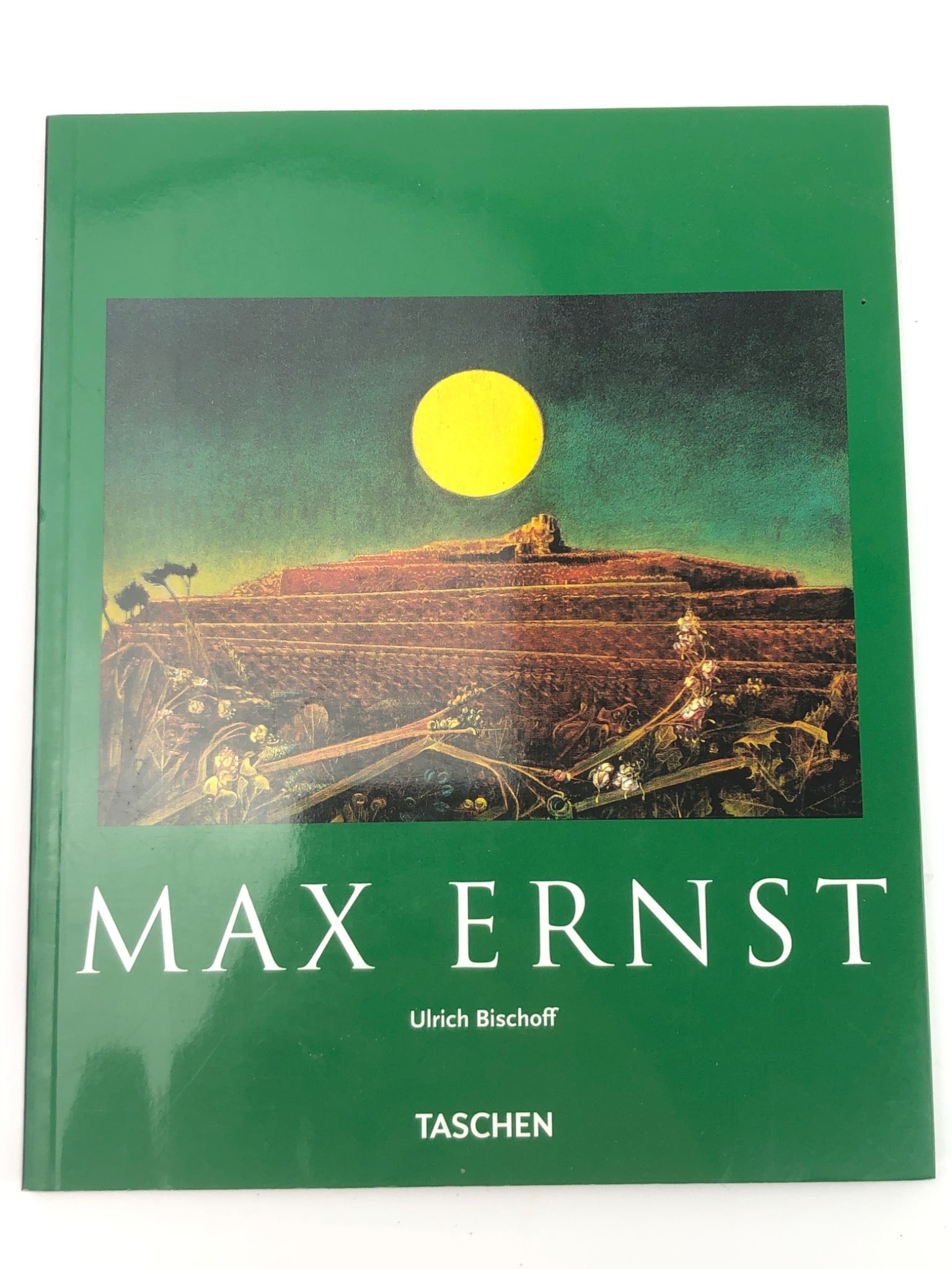 Max Ernst By Ulrich Bischoff: 2005 paperback edition of Max Ernst by Ulrich Bischoff, published by Taschen. Includes biographical text and full-color artwork by the surrealist artist. ISBN: 978-3-8228-1388-1.