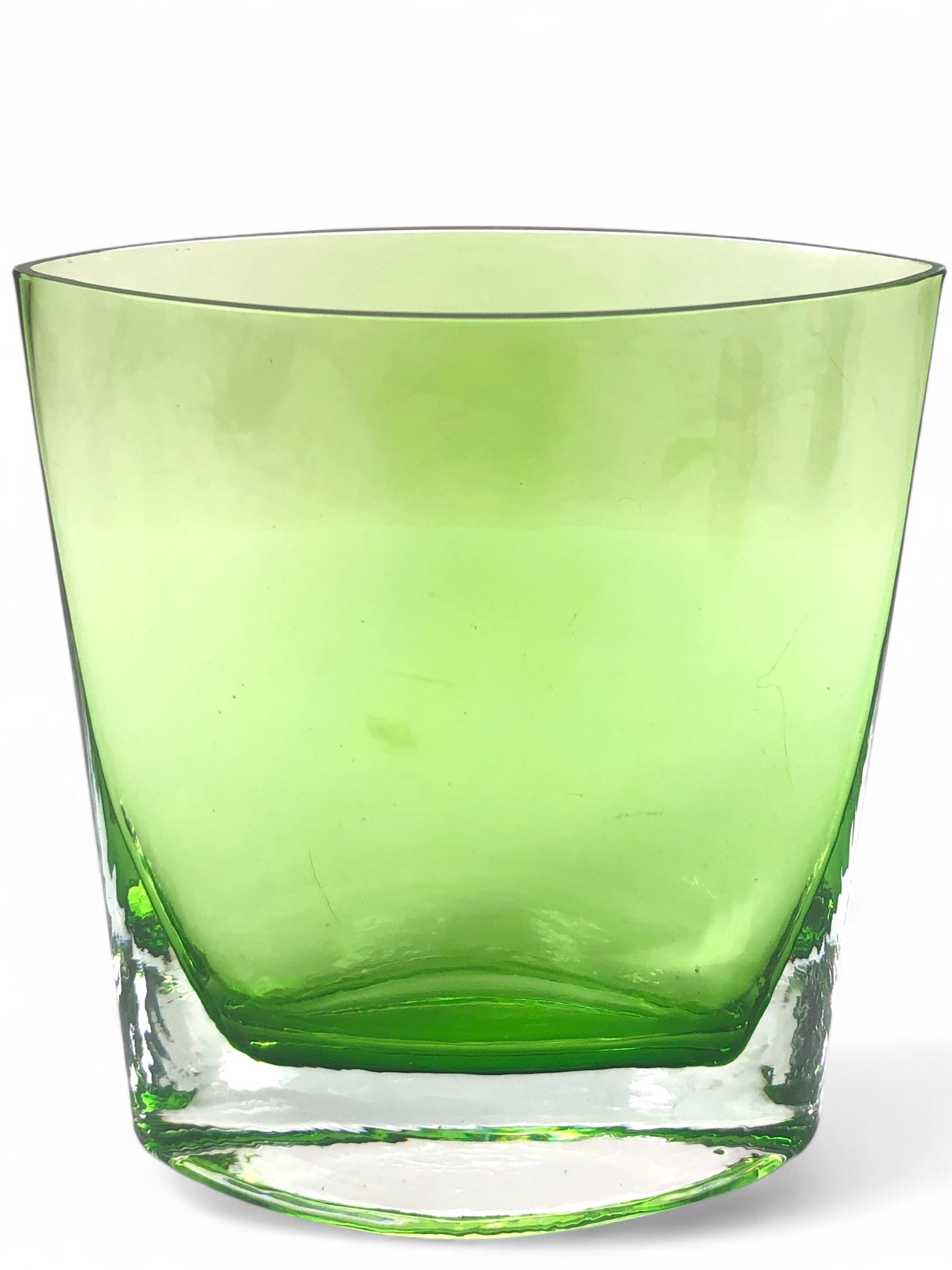 MCM Murano Attributed Crystal Vase: Mid-century modern Murano-attributed crystal vase in a vibrant green hue. Measures 6.5 inches tall. Exhibits signs of wear with small chips and scratches present. A striking collectible piece of glass