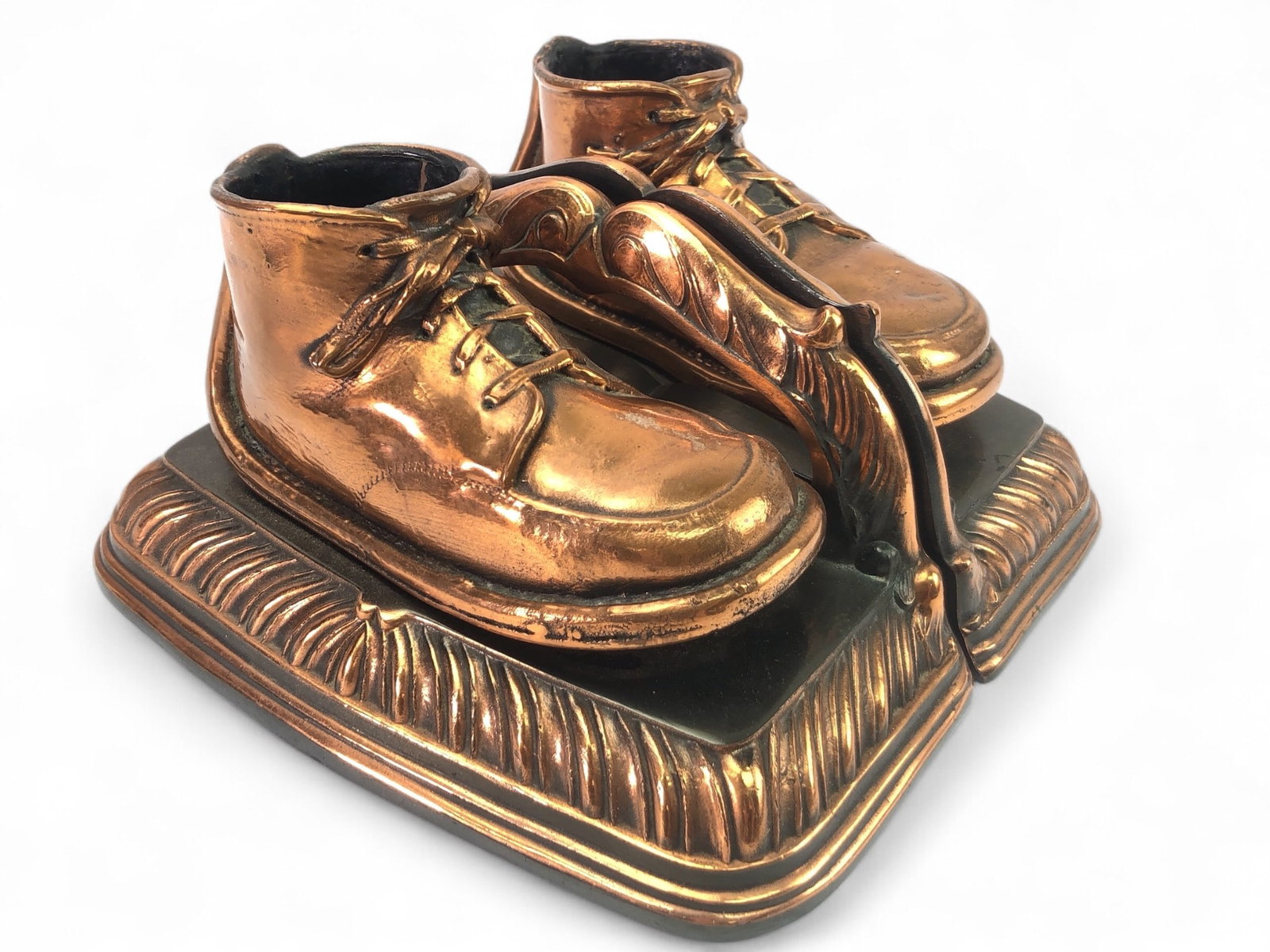 Bron-Z-Shoe Bookends With Shoe Design: Bron-Z-shoe bookends measuring 7.5 inches wide by 3.5 inches tall. Featuring a detailed baby shoe design on a decorative base with felted bottoms and original labels intact.