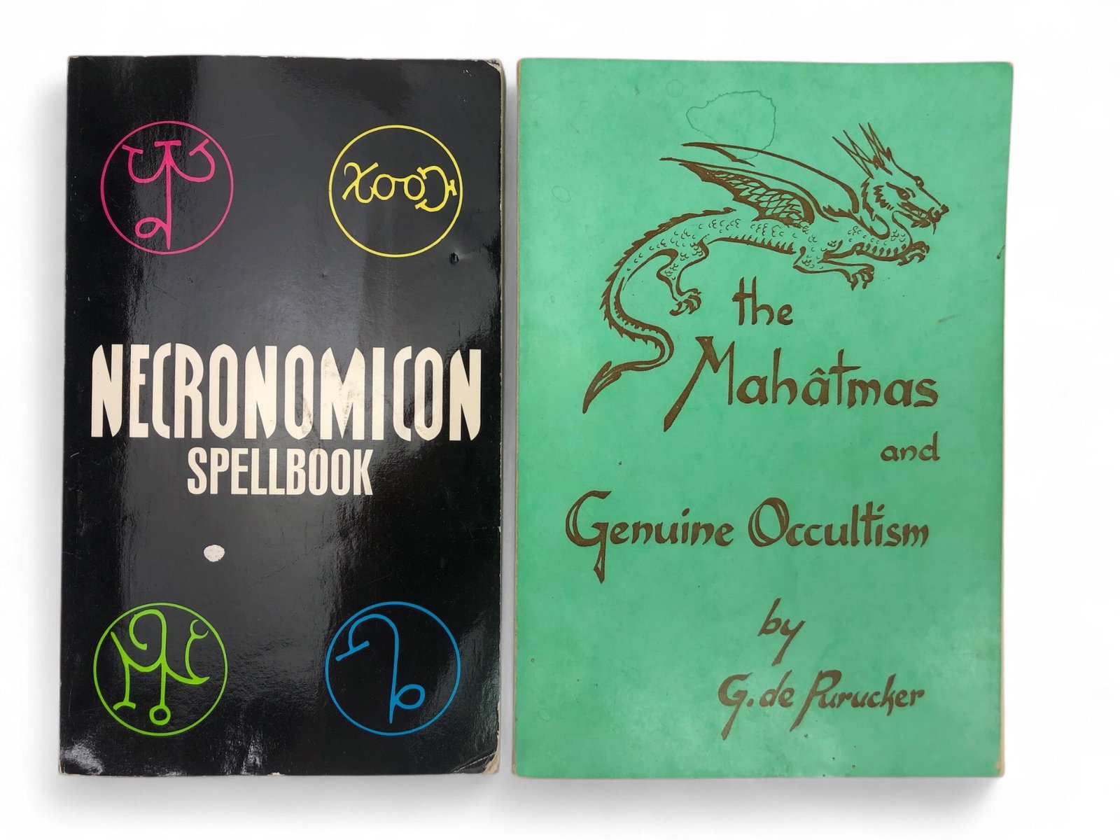 Occult Book Bundle: Necronomicon And Mahatmas: Two occult-themed books, including 'Necronomicon Spellbook' edited by Simon (Avon Books, 1998) and 'The Mahatmas And Genuine Occultism' by G. De Purucker (Point Loma Publications, revised 1972).