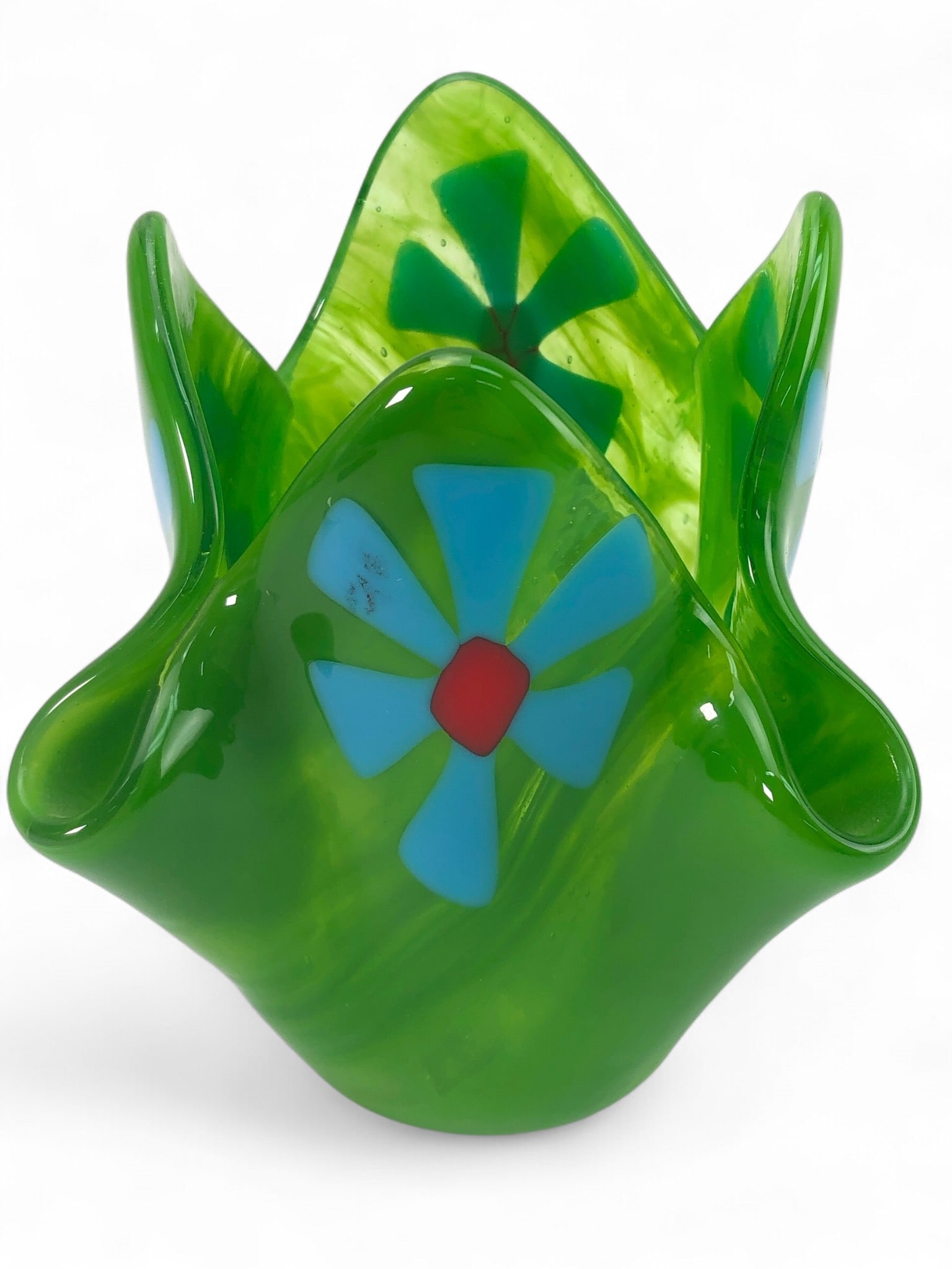 Signed Handcrafted Handkerchief Art Glass Vase: Signed handcrafted handkerchief art glass vase featuring a floral motif in vibrant green with blue and red accent details. Vase is 6 inches tall.