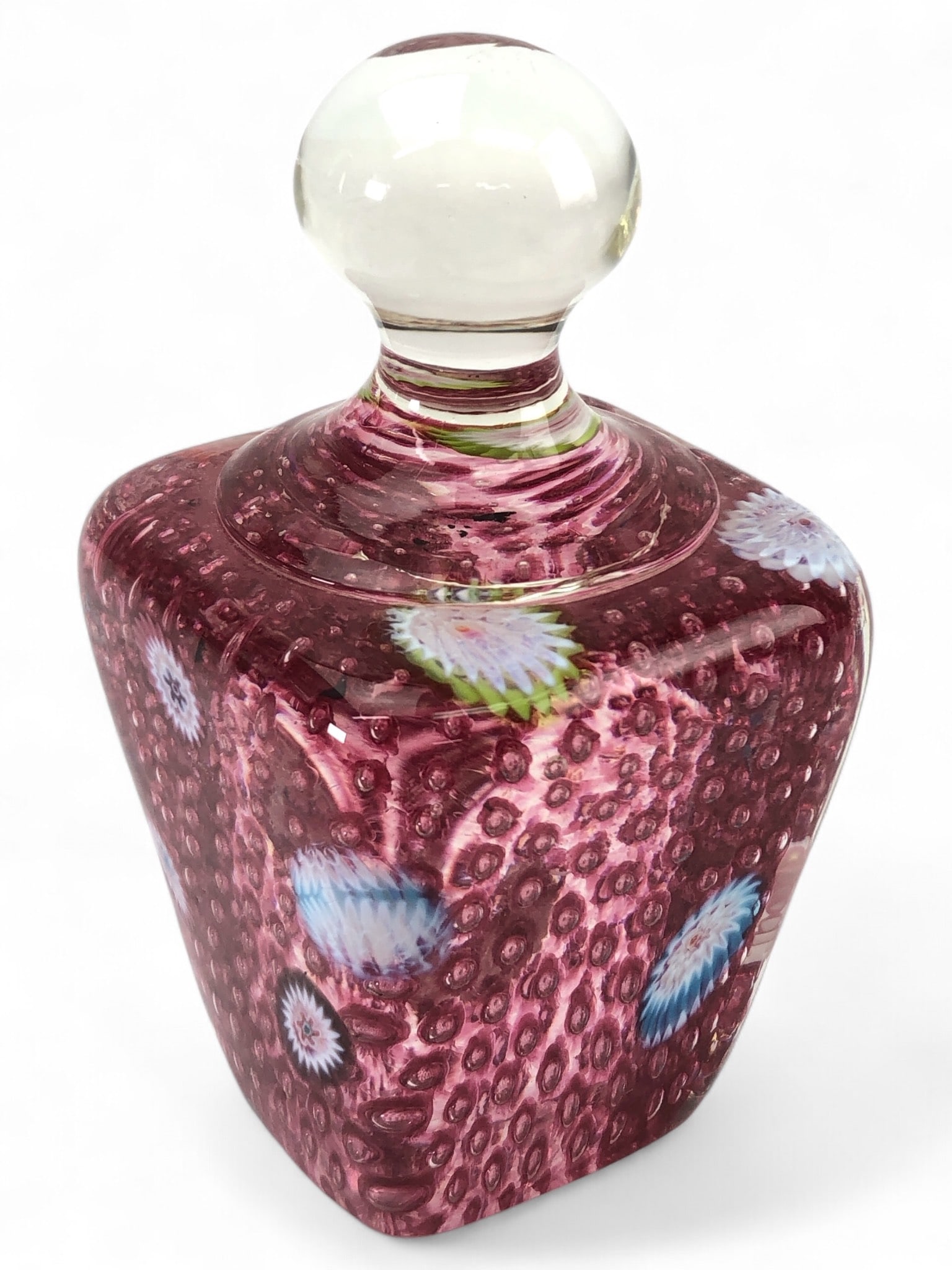 Fratelli Toso Murano Art Glass Bottle: Fratelli Toso Murano art glass bottle with a pink base color, controlled bubble design, and millefiori accents. Includes a clear spherical stopper. Approximately 4.5 inches tall.