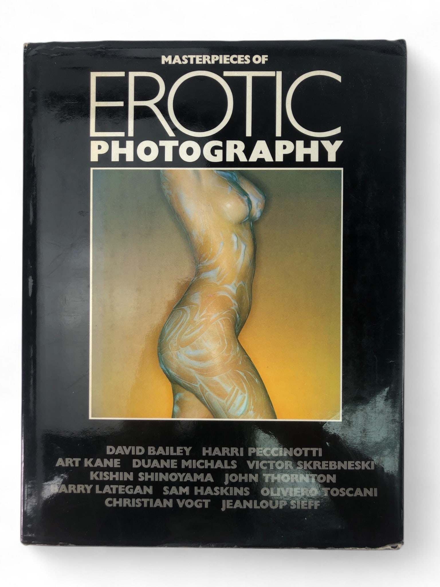Masterpieces Of Erotic Photography Hardcover: 1977 first edition, first printing hardcover book titled 'Masterpieces of Erotic Photography', published by Aurum Press. Includes dust jacket. Contains loose pages near the end of the book. Features c