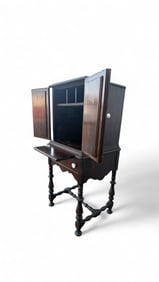 A Jacobean Style Carved Oak Cabinet-on-Stand