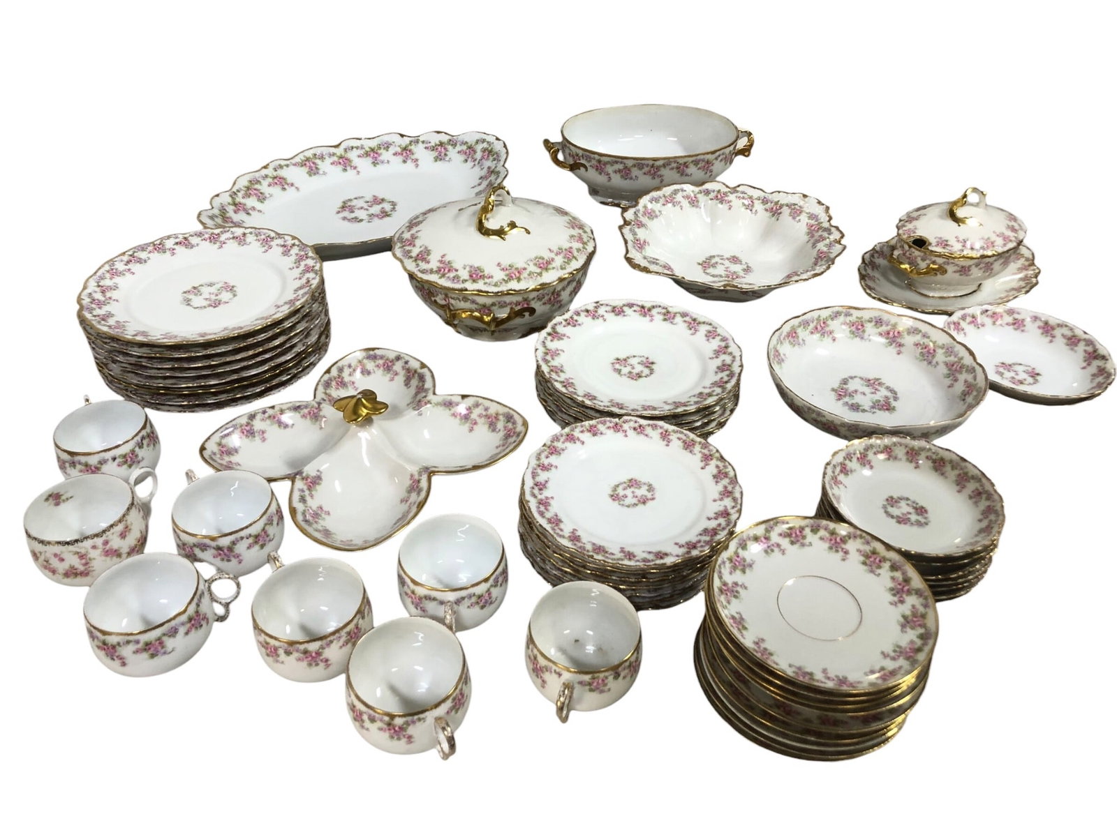 52pc Elite Works Limoges ‘Bridal Wreath’ Set: 52-piece Elite Works Limoges porcelain set featuring pink floral designs and gold trim. Includes 8 tea cups, 9 saucers, 8 dinner plates, 7 dessert plates, 5 salad plates, 7 berry bowls, 2 soup bowls,