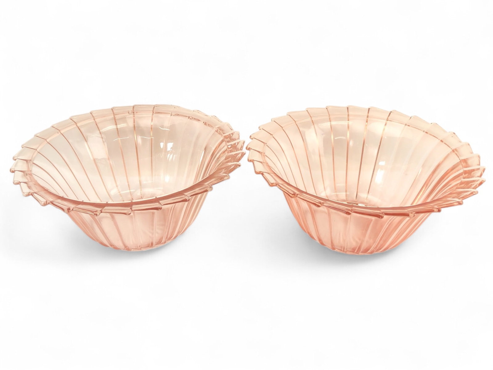 Jeannette Sierra Pink Pinwheel Depression Bowls: 1930s Jeannette Sierra pink pinwheel depression glass serving bowls with a distinctive saw-tooth rim. Each bowl measures 8.25 inches in diameter and 3.5 inches tall. Note: One bowl shows a small chip 