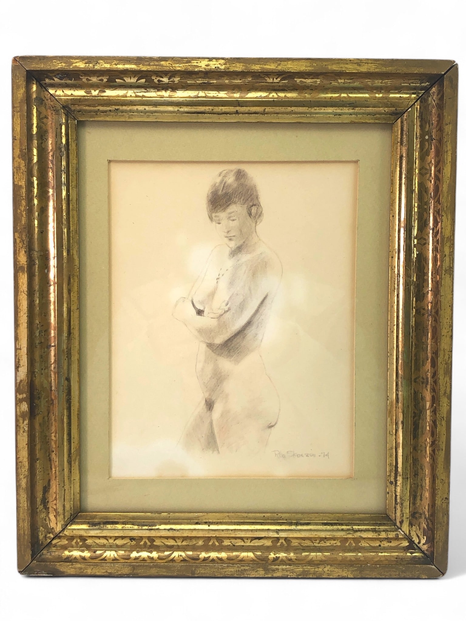 Rita Skoczen Signed Nude Portrait: Rita Skoczen signed nude portrait dated 1974. Artwork dimensions measure 10.5 x 12.5 inches including frame. Framed in a gold-tone frame with visible wear. Backing displays water stains and wear. Medi