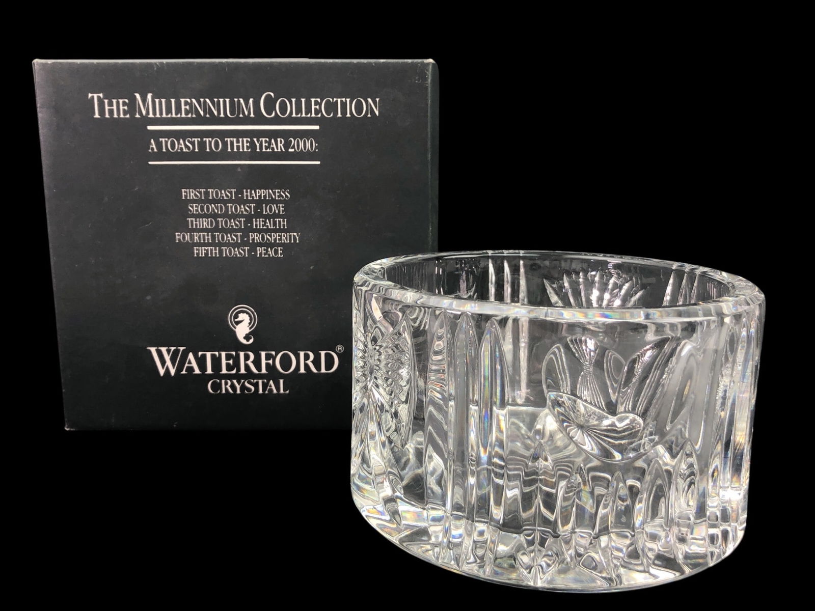 Waterford Crystal Millennium Champagne Coaster: Waterford Crystal Millennium Collection champagne bottle coaster, part of 'A Toast to the Year 2000' series. Features intricate patterns with a 5-inch diameter. Includes original box and packaging. Ma