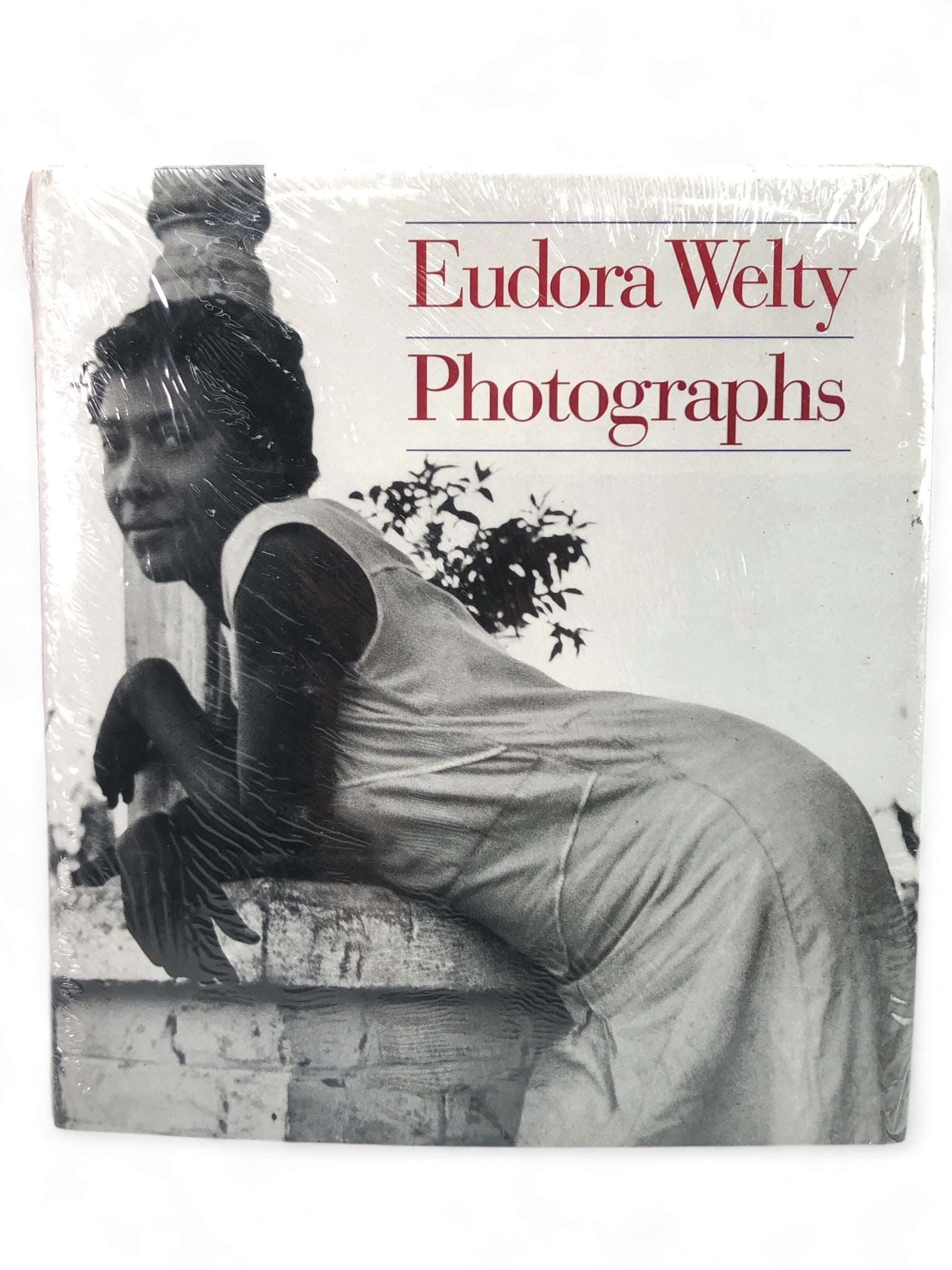 Eudora Welty Photographs Hardcover Book: Hardcover book titled 'Eudora Welty Photographs,' published by the University Press of Mississippi. Still sealed in original plastic wrapping. Features a collection of photographs by Eudora Welty, acc