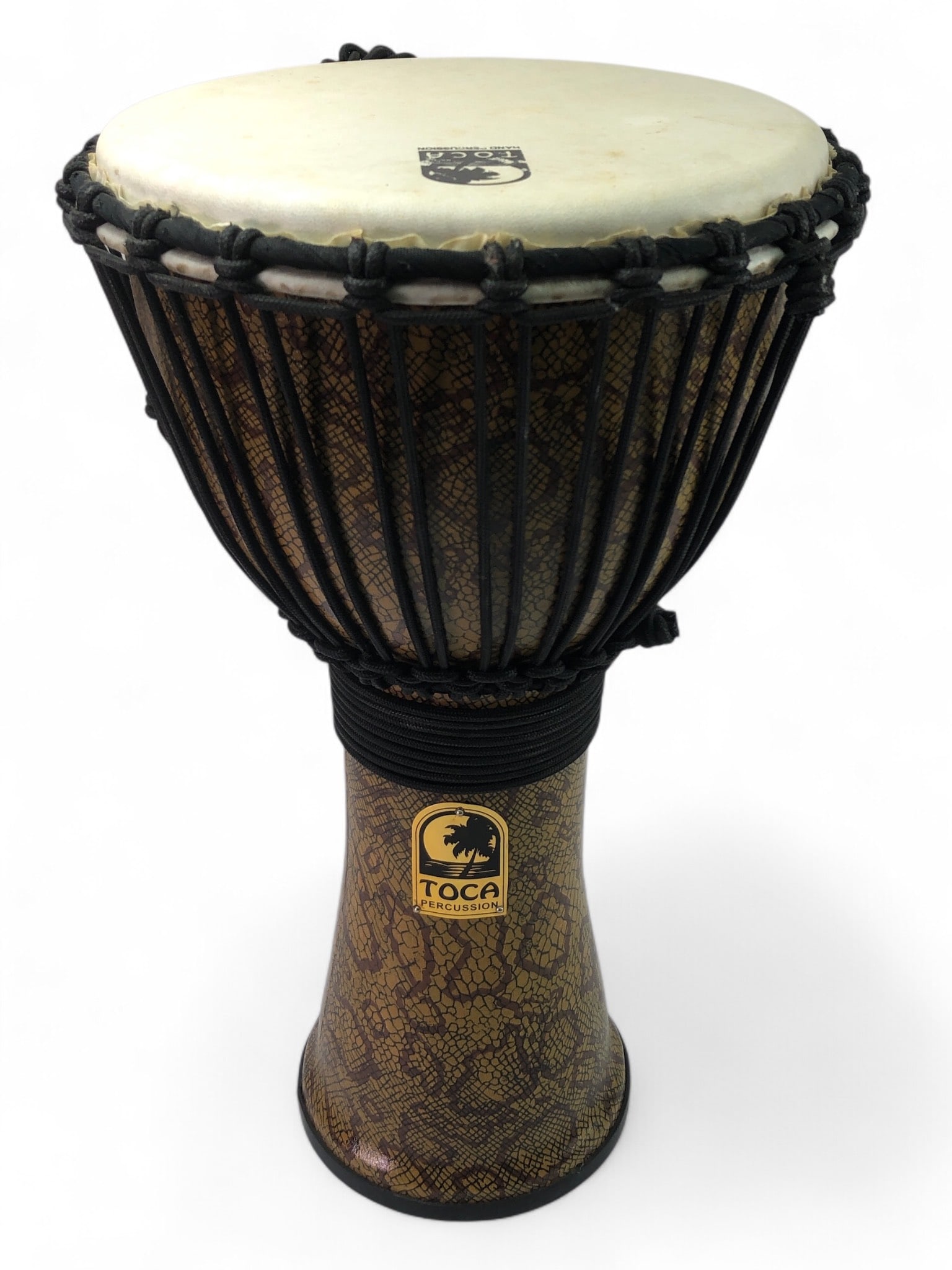 Toca Percussion Freestyle Djembe Drum: Toca professional freestyle rope-tuned djembe drum with goatskin head. Measures 19.25 inches tall. Features a textured, snake-print design on the shell and black rope-tuning. Marked "Toca Percussion"