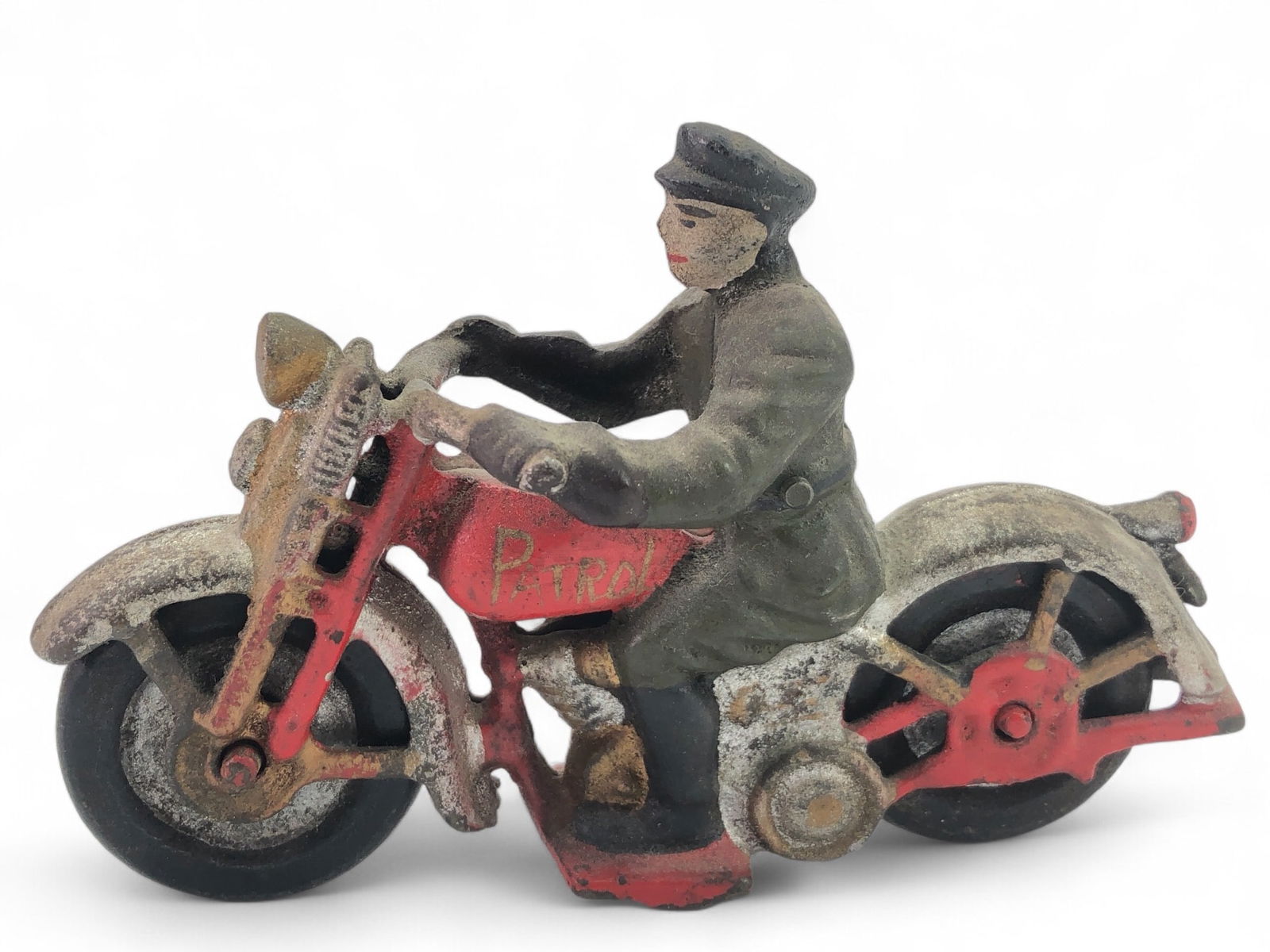 Vtg Hubley Cast Iron Police Patrol Motorcycle: Vtg cast iron police patrol motorcycle by Hubley, measuring 6 inches long. Features a rider in a uniform with red accents on the motorcycle. Moderate surface wear consistent with age. A collectible mo