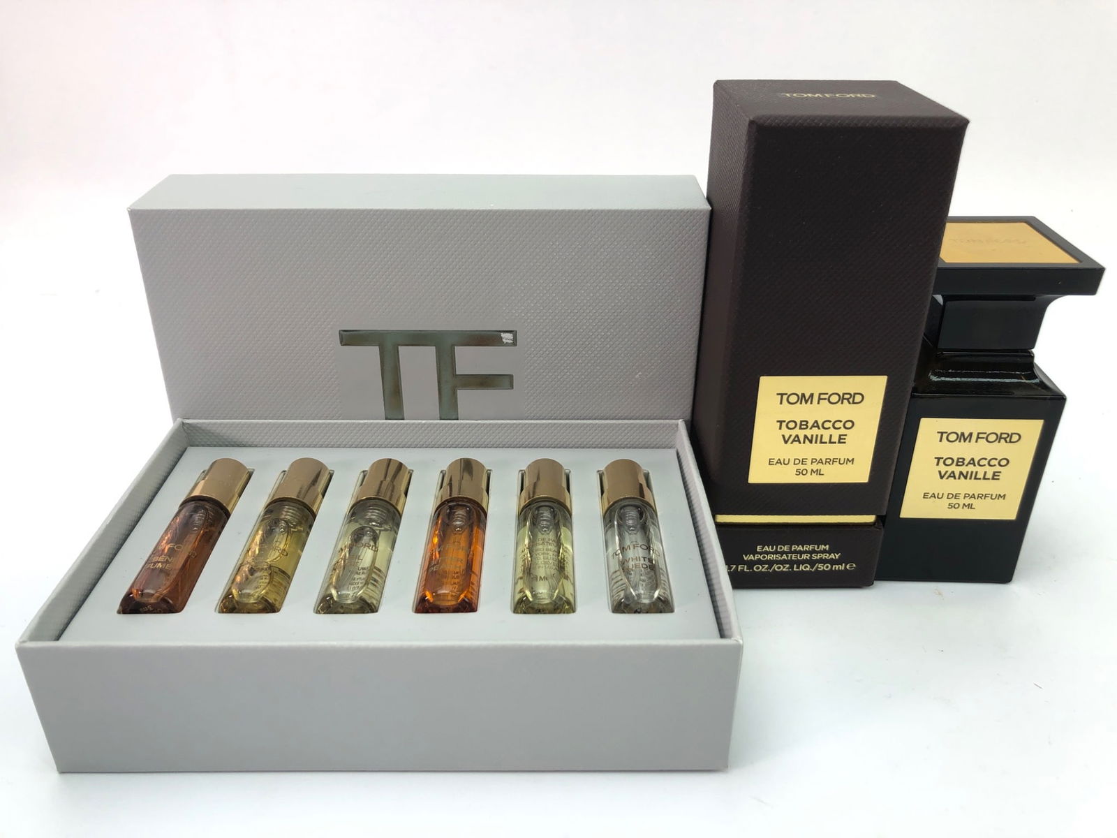 Tom Ford Tobacco Vanille & Discovery Set: Tom Ford Tobacco Vanille Eau De Parfum (50ml) with approximately 60% remaining. Includes Private Blend Discovery Collection featuring six 1.0ml mini spray bottles of assorted scents: White Suede, Rose