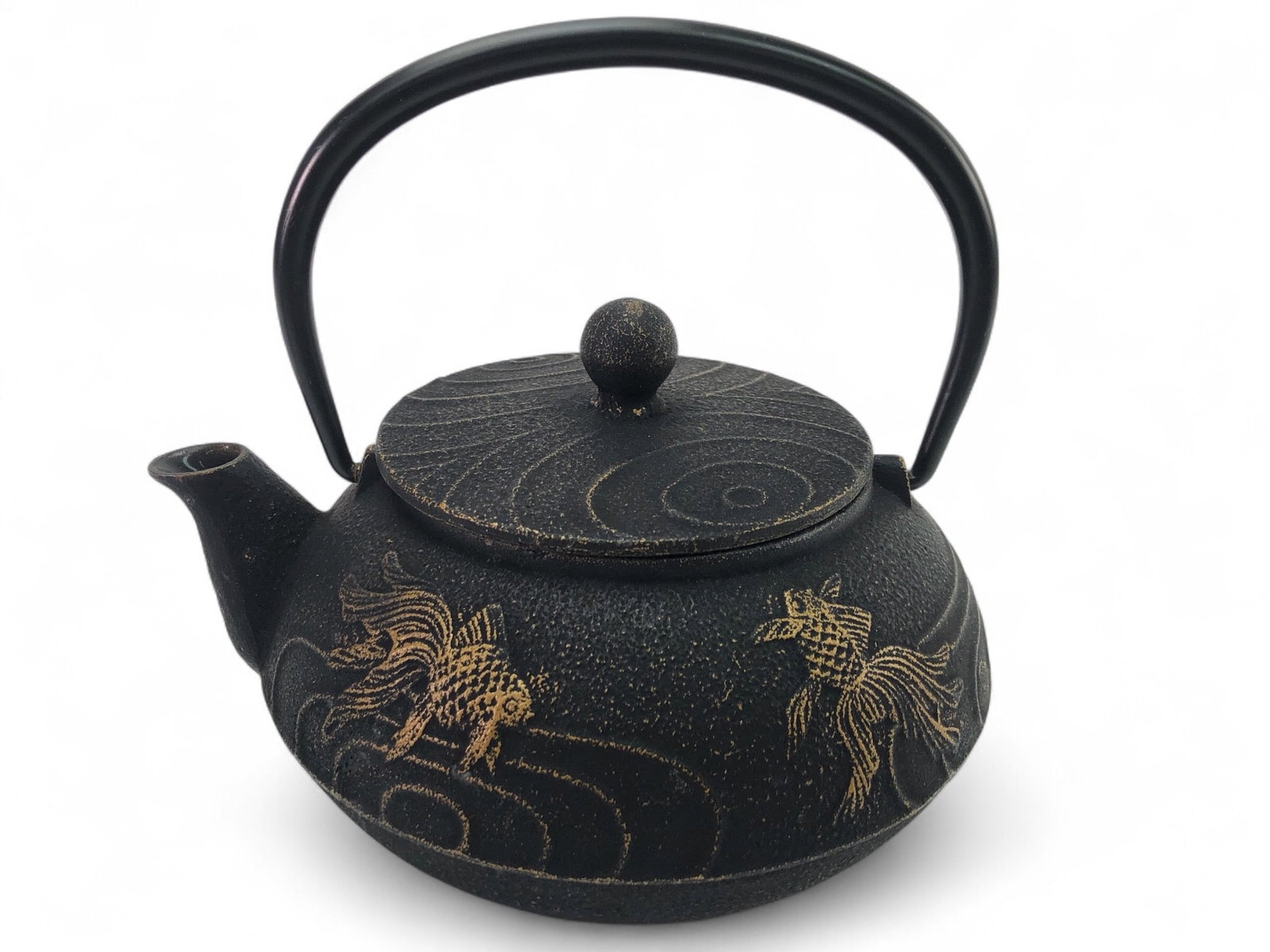 Iwachu Japanese Tetsubin Iron Teapot With Lid: Iwachu Japanese tetsubin iron teapot featuring a goldfish design with an enamel-coated interior to prevent rust. Stands 5.5 inches tall with the handle upright. Marked 'Made in Japan' on the base. Fun