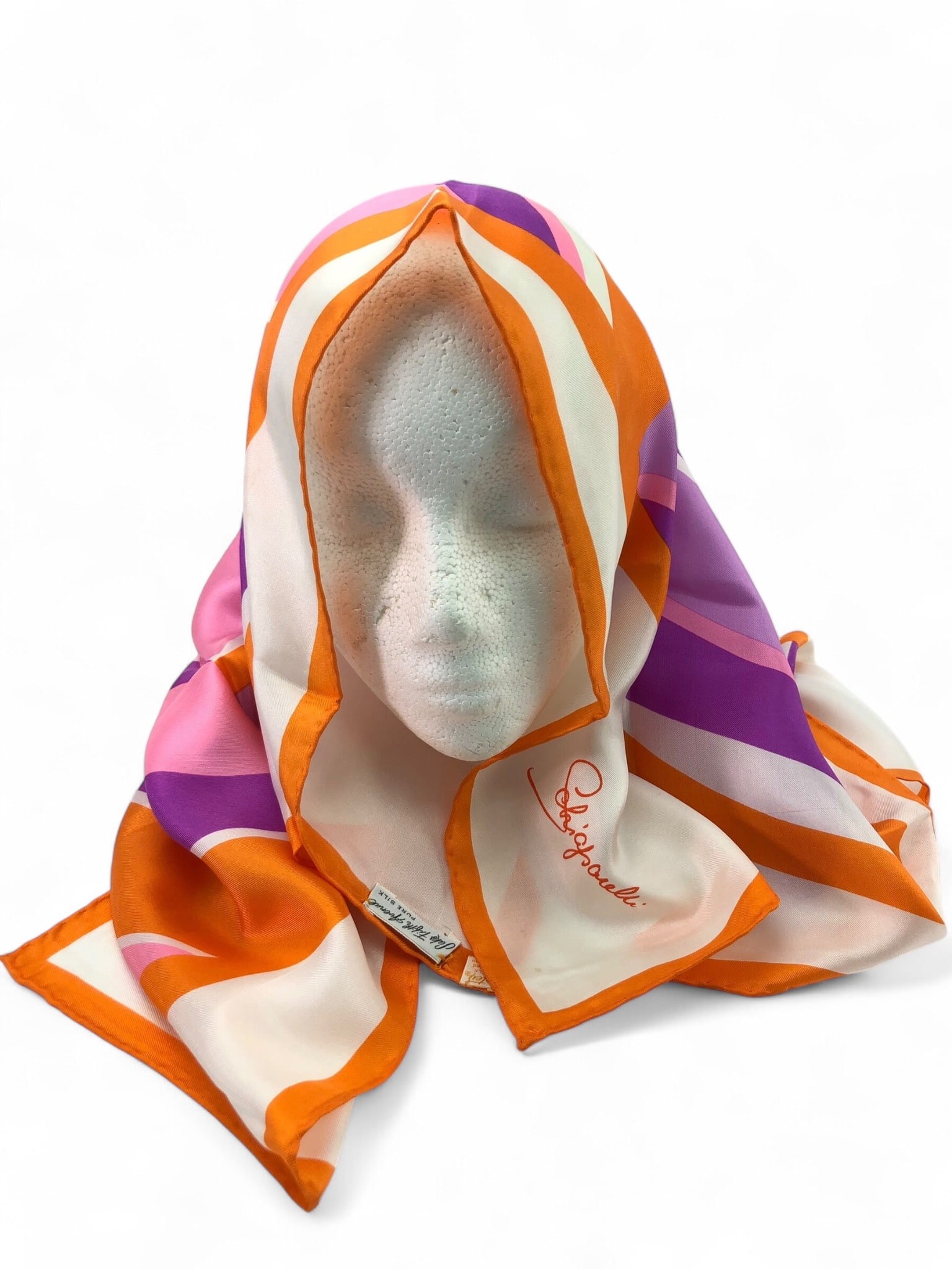 Schiaparelli & Saks Fifth Avenue Scarf: Schiaparelli silk scarf for Saks Fifth Avenue featuring a geometric design in orange, pink, purple & white. Signed 'Schiaparelli' in orange. Made of pure silk. Dimensions are 28.5 x 28.5 inches. Some