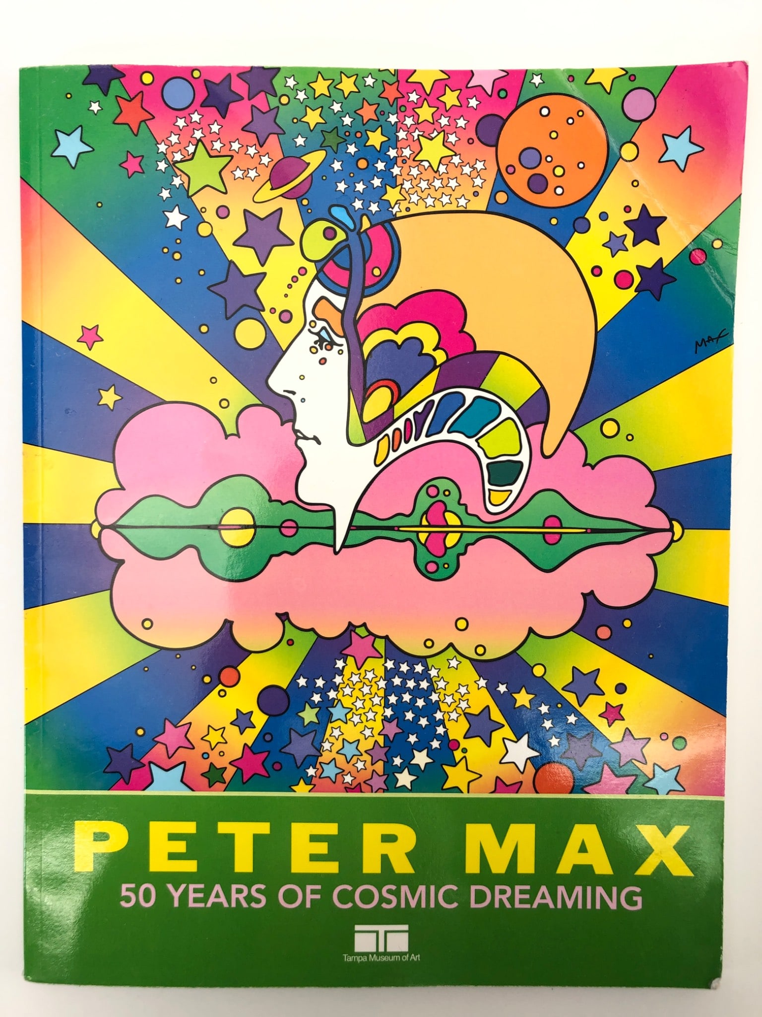 Rare 2016 Peter Max 50 Years Of Cosmic Dreaming: Softcover book titled 'Peter Max: 50 Years of Cosmic Dreaming,' published in 2016 in conjunction with the Tampa Museum of Art retrospective. Features artwork, artist statements, chronology & selected