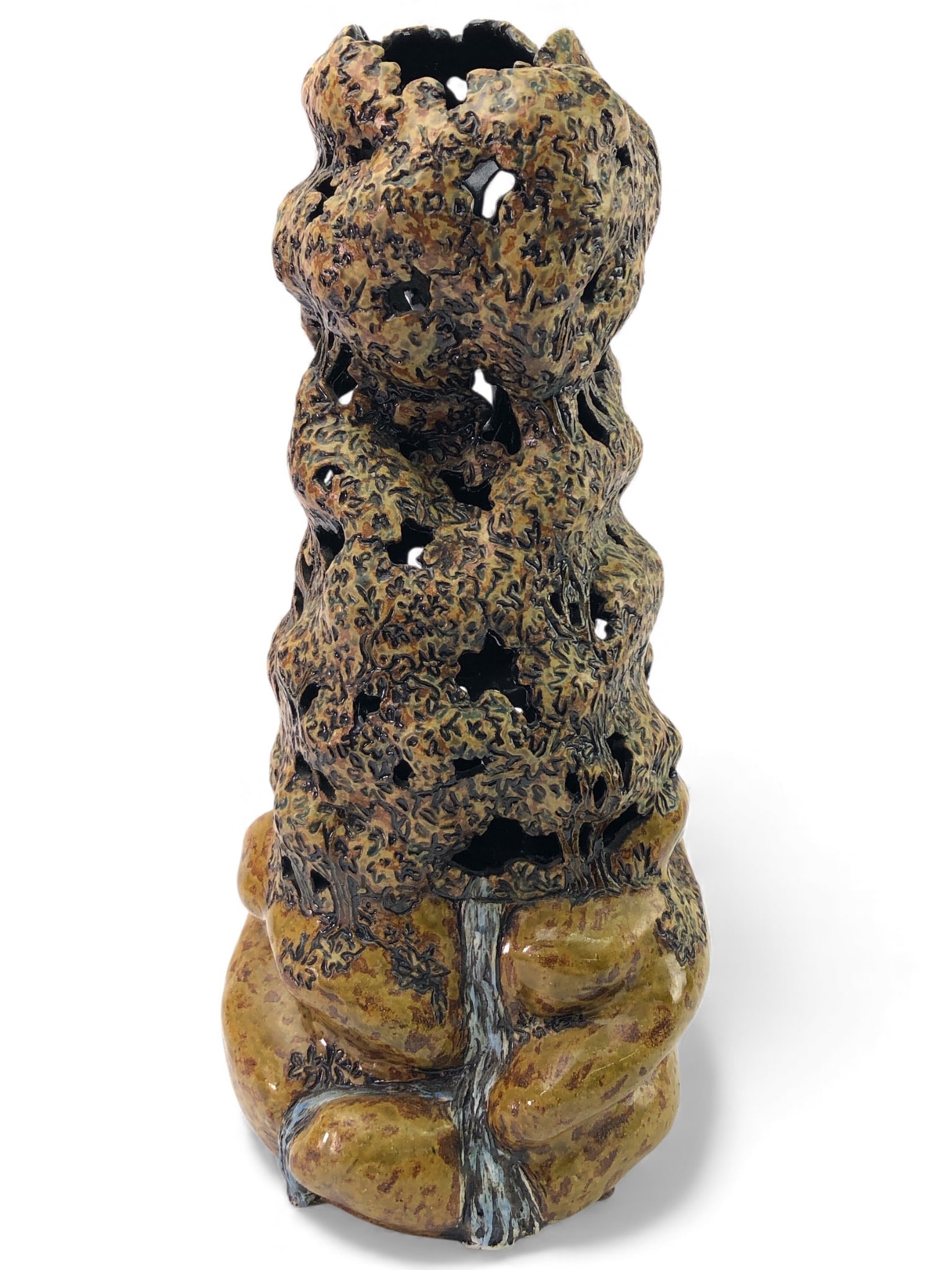 Signed Leftwich Pottery Sculptural Vase: Signed Leftwich Pottery vase crafted in 2005 in Horse Shoe, NC. Sculptural design with intricate cut-out details, earthy glaze tones, and textured surfaces. Measures approximately 15.5 inches tall. Ma