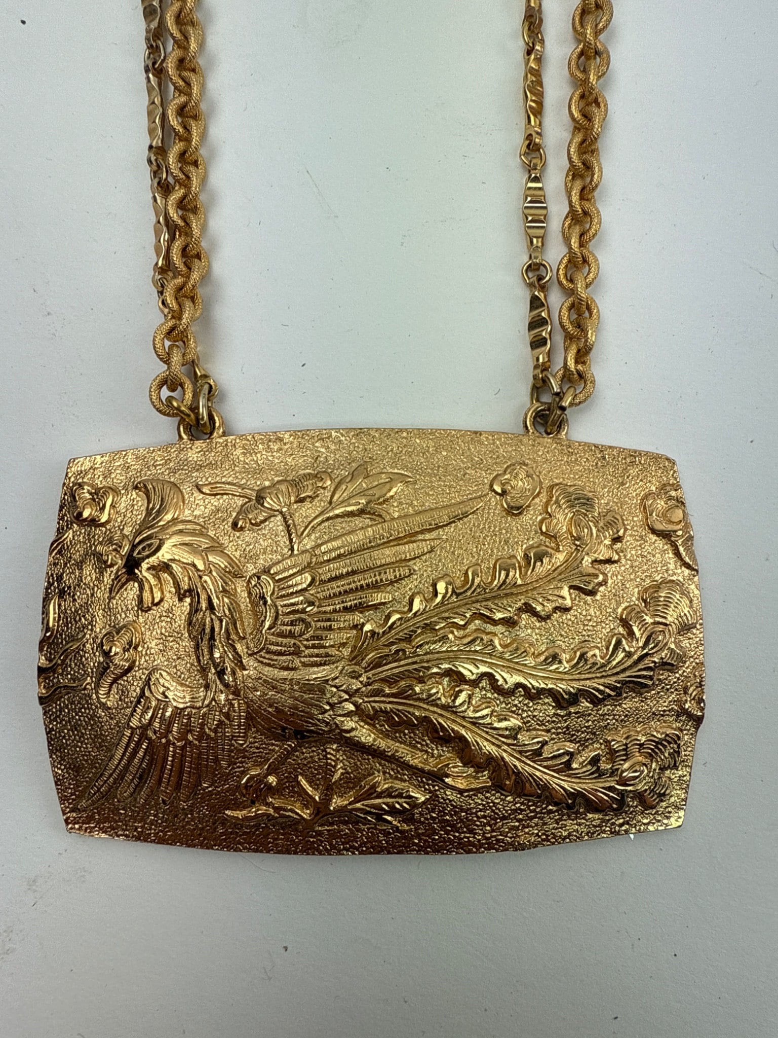 Vintage Napier Bird Of Paradise Choker: Napier vintage Bird of Paradise choker featuring a 3.5" x 2.5" gold-tone medallion. Two 7-inch double strands complete the necklace. Intricate relief design of a bird of paradise on the medallion. Sig