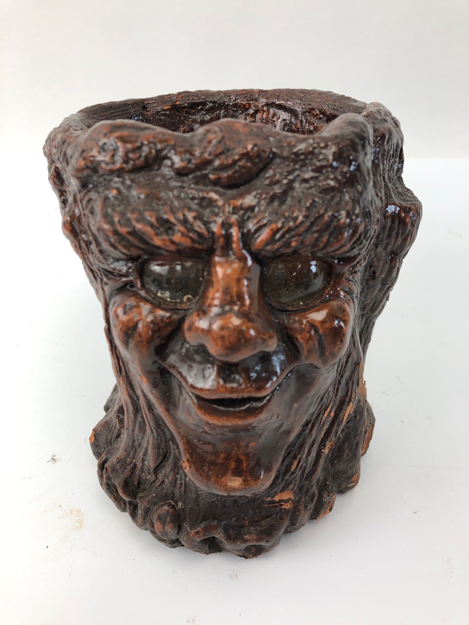 Signed Jason Christoble Matchess Candleholder: Signed Jason Christoble sculptural matchless grove candleholder, standing 5 inches tall. Features a textured face design. Shows wear with candle wax residue inside. Some visible signs of use. A unique