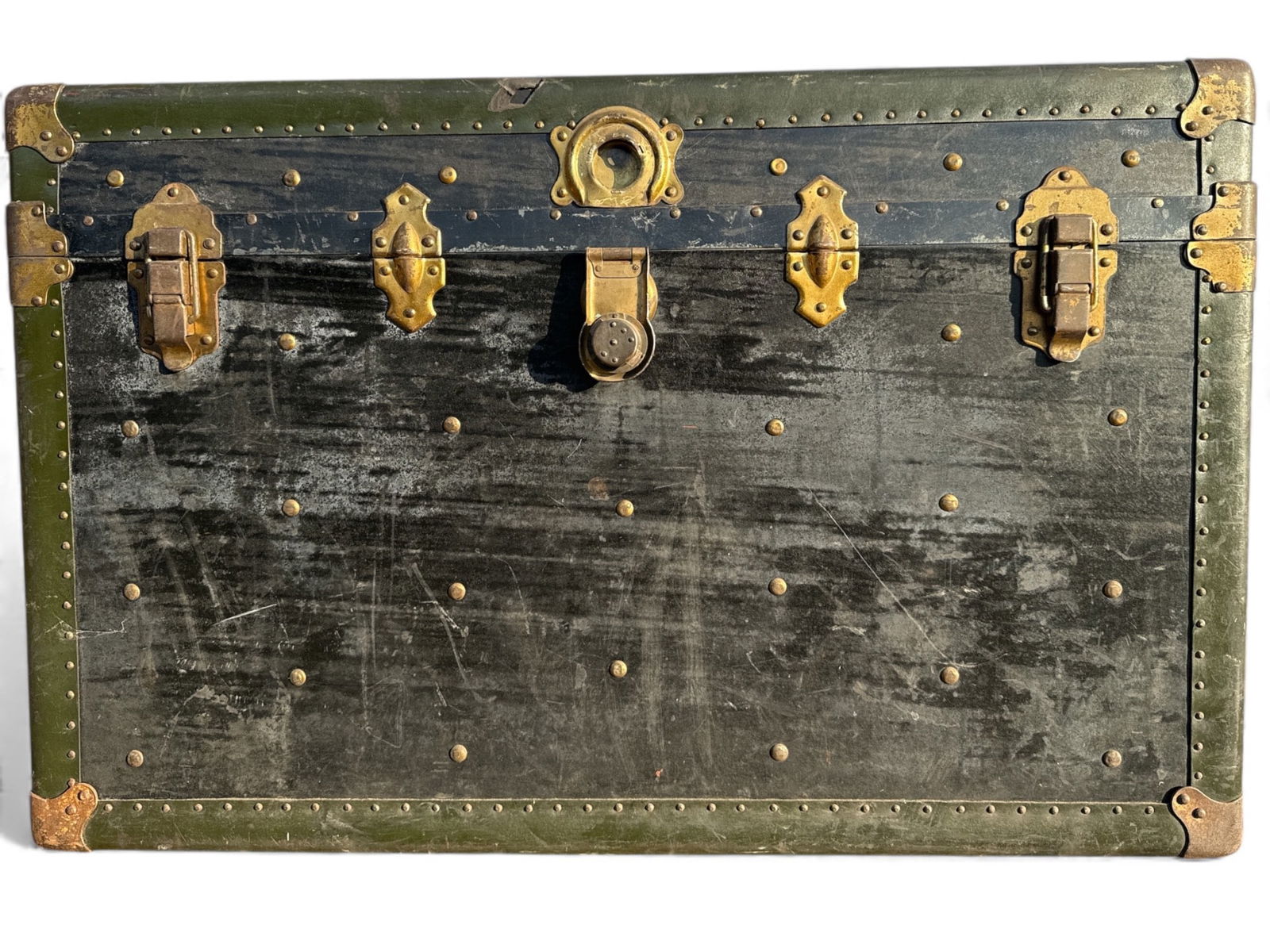Schmit Trunk Co Early 20th Century Steamer: Early 20th century steamer trunk by Schmit Trunk Co, branded as Travelwell Trunks. Made of wood with metal accents & rivet detailing. Features an interior with floral-patterned fabric lining. Dimensio