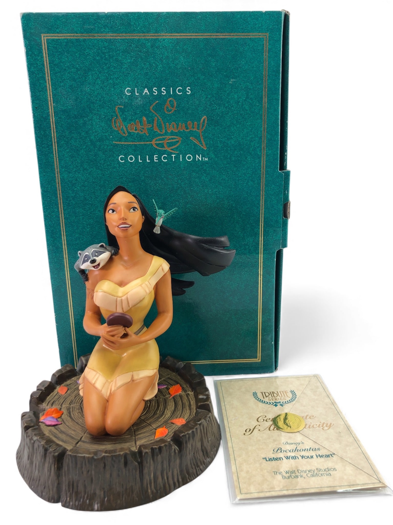 Disney WDCC Pocahontas Listen With Heart: Walt Disney Classics Collection "Listen With Your Heart" Pocahontas figurine from the Tribute Series. Includes base, certificate of authenticity, & original box. Figurine handcrafted in Thailand. Stan