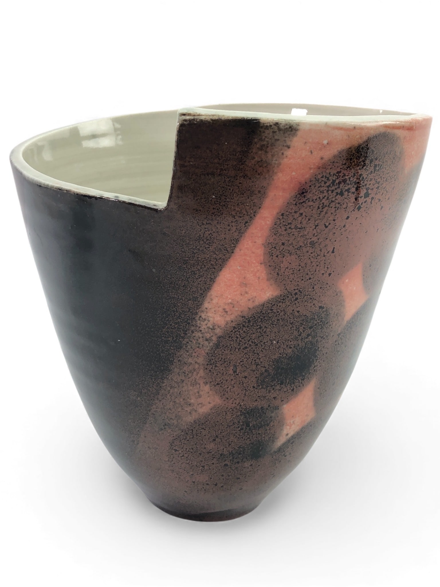 Signed Pottery Vase With Cutout Rim: Signed pottery vase featuring a unique cutout rim design. Measures 6.5 inches to the tallest point. Features a blend of black, brown & red tones with a smooth interior. Maker's signature inscribed on