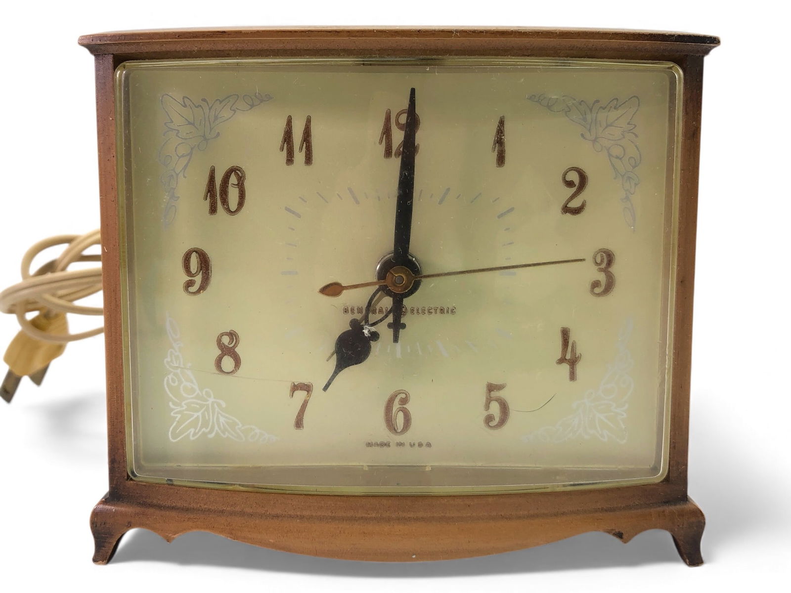 MCM General Electric Faux Wood Grain Clock: MCM General Electric faux wood grain nightstand alarm clock, model 7280. Features vintage styling with a faux wood case. Operates on 115V, 60 Hz. Tested & working. Stands 4 inches tall & includes orig