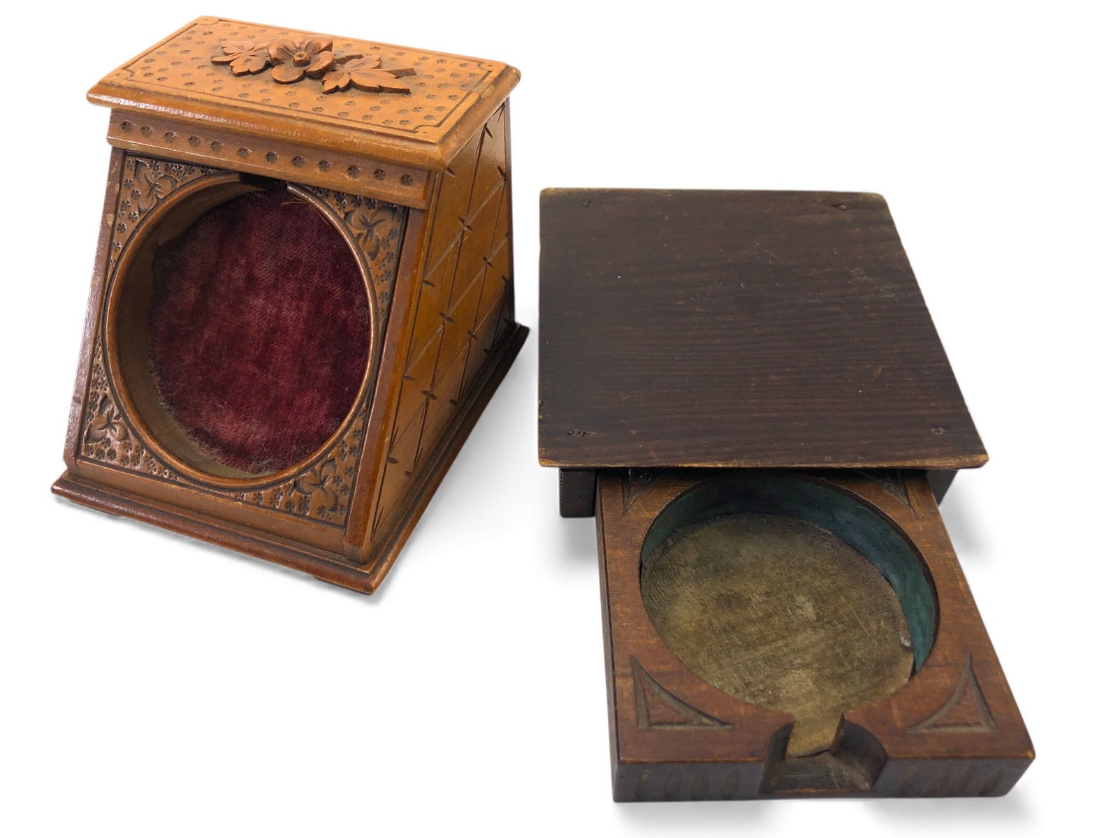 2 Vtg Wood Carved Watch Holders: Two vintage wood-carved watch holders featuring intricate detailing on their external surfaces. One has a sliding compartment and velvet interior lining, while the other showcases floral carving on th
