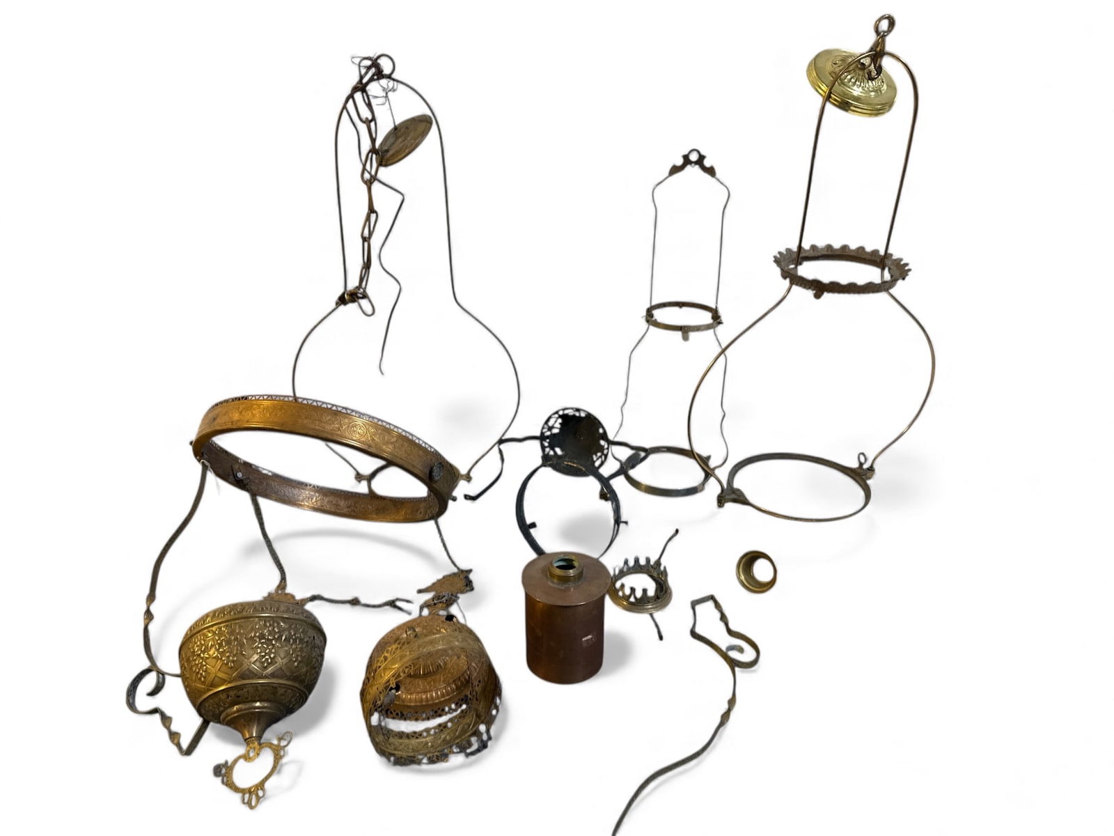 Antique Brass & Metal Oil Lamp Parts: Brass & metal lamp parts including filigree, crowns, chains, and other decorative components. Tallest piece measures 30 inches. Ideal for restoration or repurposing projects. Items show varying levels