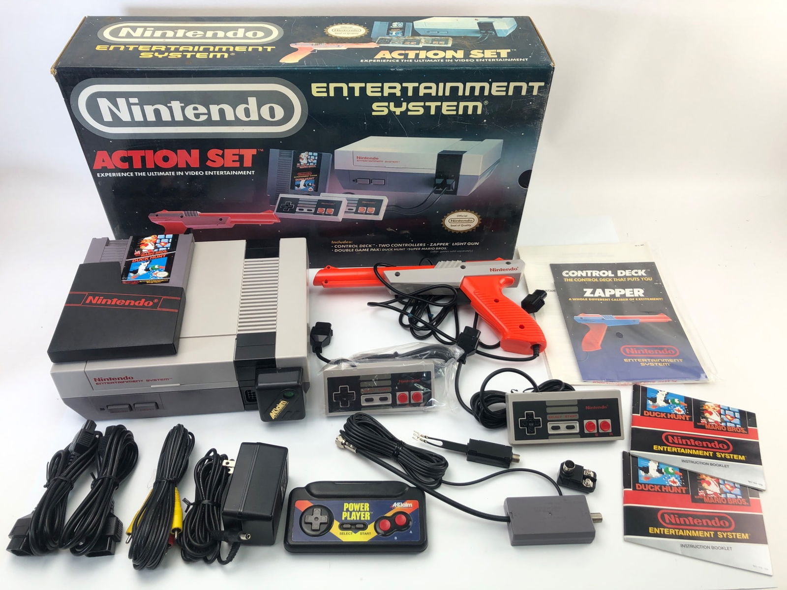 Nintendo NES Console Action Set With Accessories: Nintendo NES Action Set including console, original box, two controllers, Zapper gun, Power Play controller, cords, manuals, and a double game pak with Duck Hunt & Super Mario Bros. Console is unteste